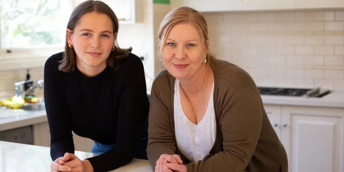 Mother and teenage daughter at home